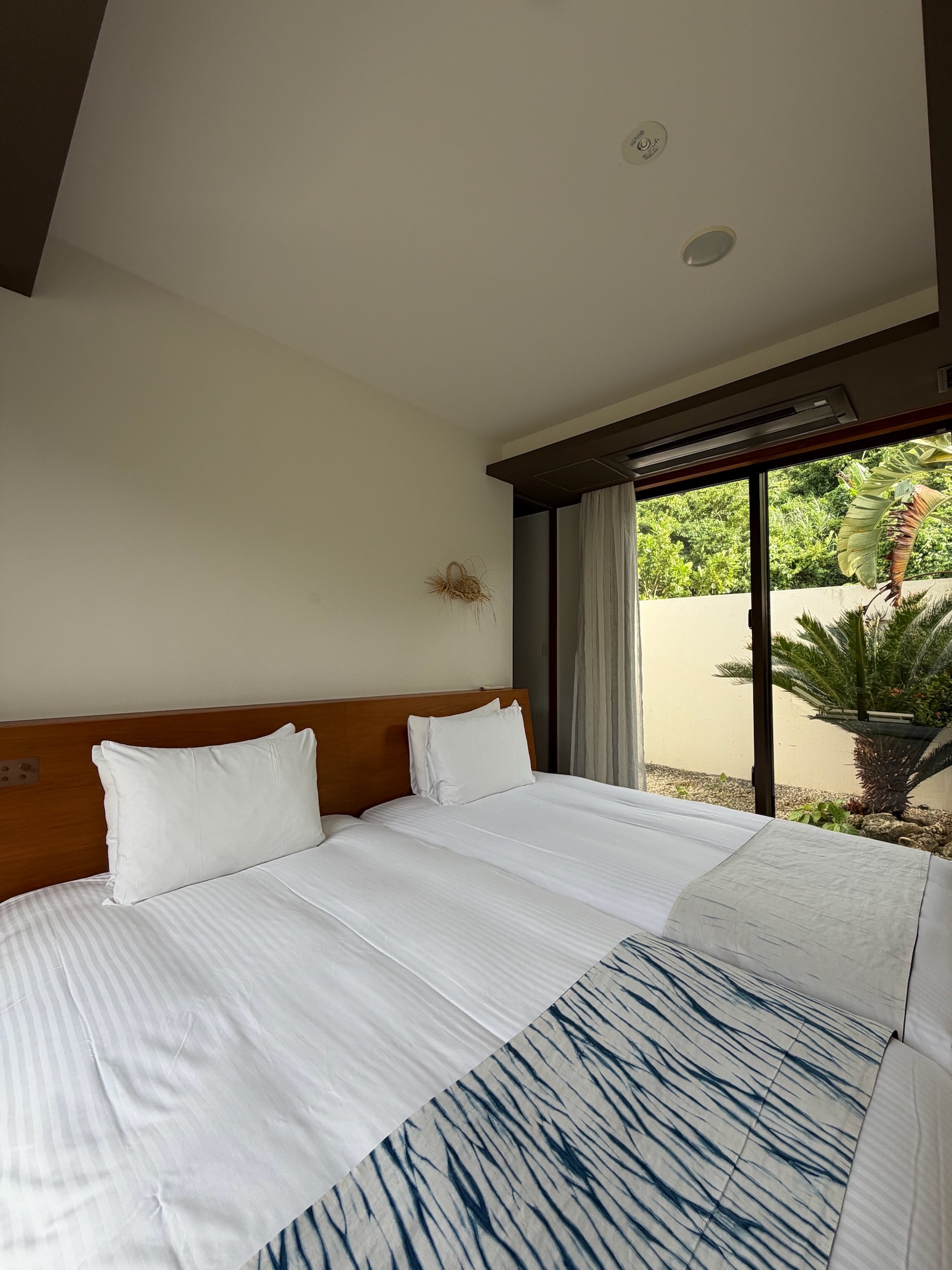 the rescapeのプレミアスイートヴィラの寝室 / Premier Suite Villa bedroom at the rescape